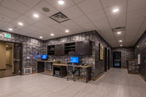 an office with a desk with a computer on it at Fairfield Inn & Suites by Marriott Denver Downtown in Denver