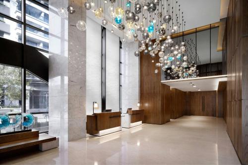a lobby of a building with a chandelier at Fairfield by Marriott Taichung in Taichung