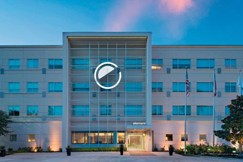 an office building with a large logo on it at Element Houston Vintage Park in Houston