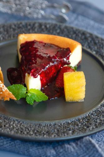 a piece of cake with strawberries on a plate at Element Bali Ubud in Ubud
