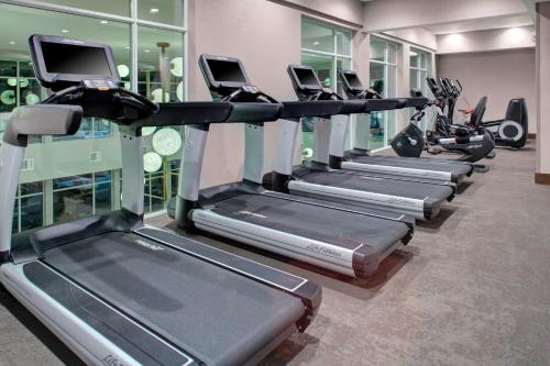a row of tread machines in a gym at Fairfield by Marriott Inn and Suites Boulder Broomfield Interlocken in Broomfield