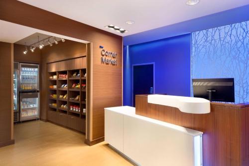 a dental office with a counter and a blue wall at Fairfield Inn & Suites by Marriott Lancaster East at The Outlets in Lancaster