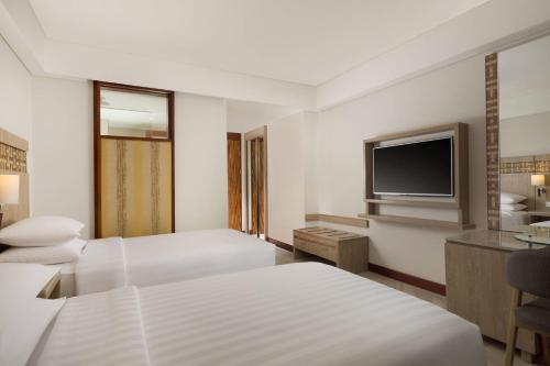 Ένα ή περισσότερα κρεβάτια σε δωμάτιο στο Fairfield by Marriott Bali Legian
