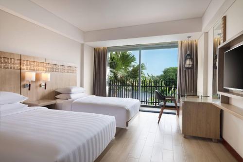Ένα ή περισσότερα κρεβάτια σε δωμάτιο στο Fairfield by Marriott Bali Legian