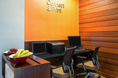 an office with a desk with a computer and a bowl of bananas at Fairfield Inn & Suites by Marriott San Antonio Downtown/Market Square in San Antonio