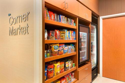 a grocery store aisle with a shelf full of food at Fairfield Inn & Suites Midland in Midland