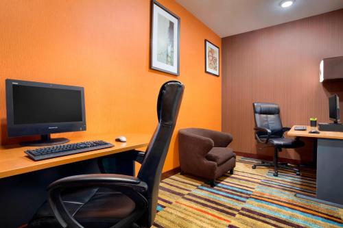 an office with a desk with a computer and two chairs at Fairfield Inn & Suites Fort Worth University Drive in Fort Worth