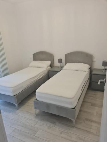 Ένα ή περισσότερα κρεβάτια σε δωμάτιο στο Residence Adriano