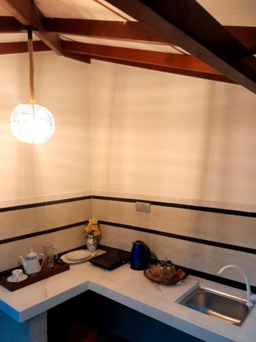 a kitchen with a sink and a counter top at Serendib Villa in Ahangama