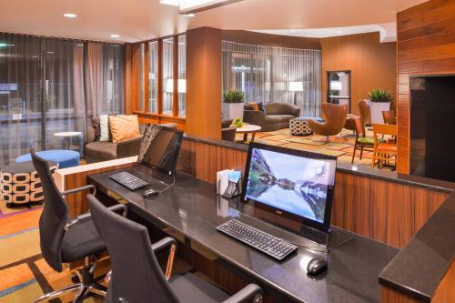 an office with a desk with a computer on it at Fairfield Inn & Suites Orlando Ocoee in Orlando