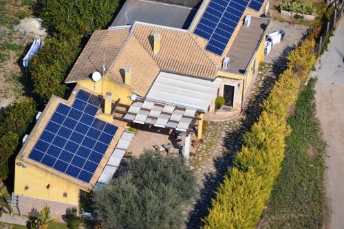 an aerial view of a house with solar panels on it at Villa Adriana B&B in Comiso
