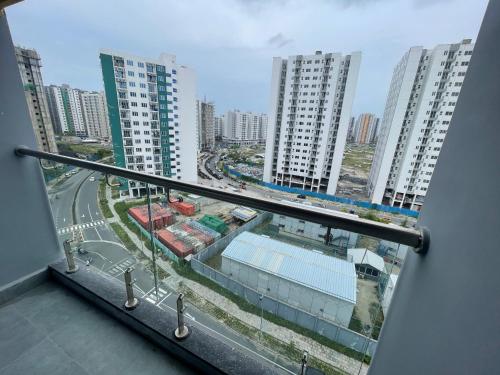 a view of a city from a balcony of a building at Clove Beach Hulhumale in Male City