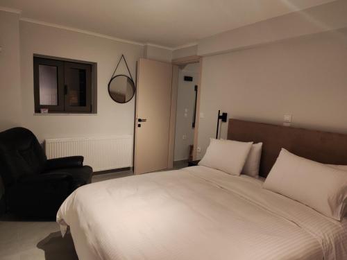 Postel nebo postele na pokoji v ubytování Pavliani Apartments