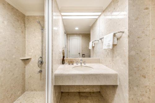 a bathroom with a sink and a shower at Artistic Studio in Taichung