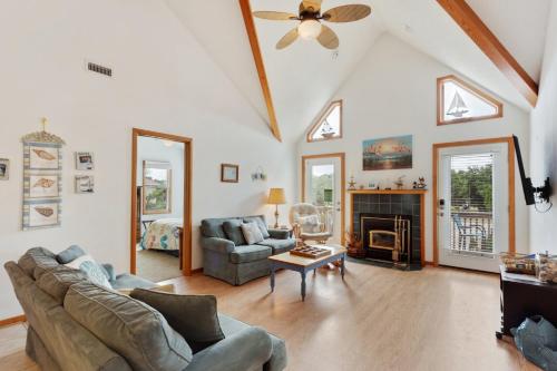 a living room with a couch and a fireplace at 1714 - Destiny in Poplar Branch