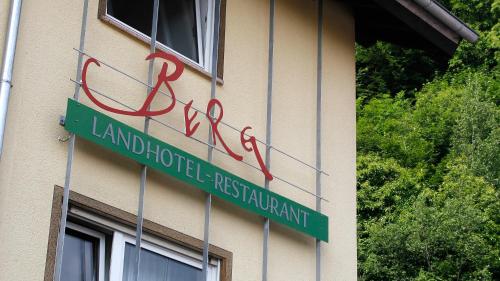 a street sign on the side of a building at Hotel Berg in Dannenfels
