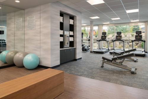 a gym with a row of treadmills and machines at Fairfield Inn & Suites by Marriott Wenatchee in Wenatchee