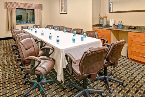 a conference room with a table with bottles of water on it at Baymont by Wyndham Decatur in Decatur