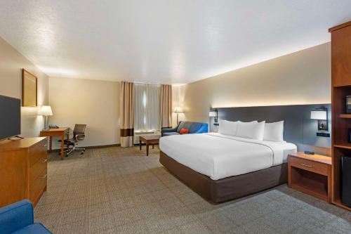 a large hotel room with a bed and a television at Comfort Inn Richfield I-70 in Richfield