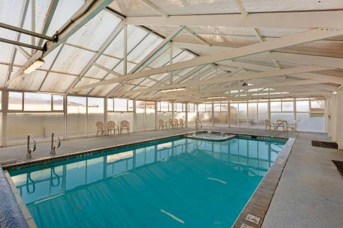 a large swimming pool with a glass ceiling at Comfort Inn Richfield I-70 in Richfield