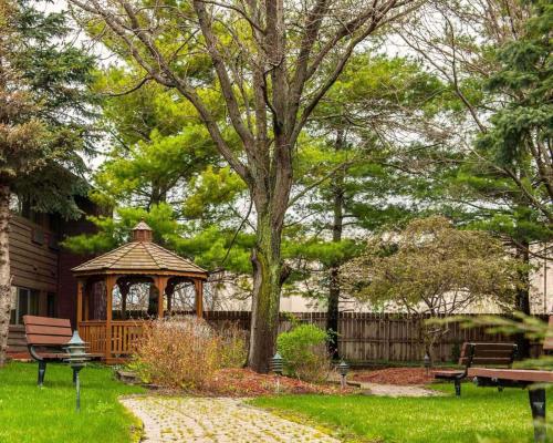 a gazebo in the middle of a yard at Quality Inn & Suites Goshen in Goshen