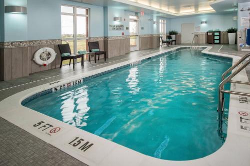 a large swimming pool in a hotel lobby at Fairfield Inn & Suites by Marriott Easton in Easton