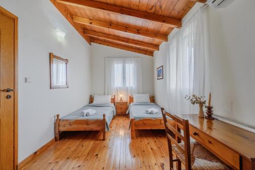 Postel nebo postele na pokoji v ubytování Villa Galini