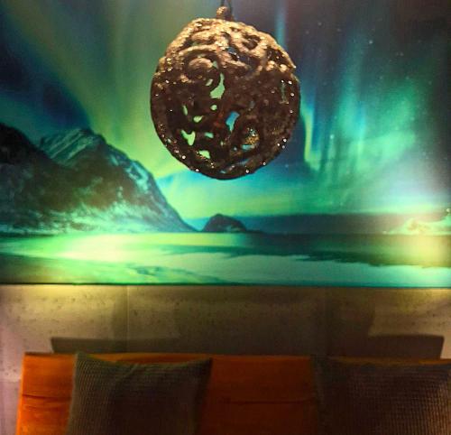 a room with a painting of a doughnut on the wall at Apartamenty Spokoloko Ostoja Beskidy ARKTYKAloft i Rapa Nui in Szczyrk