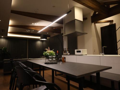 a dining room with a table and some chairs at 1980 fuji yamanakako in Yamanakako