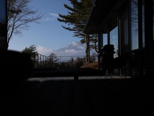 a view of a snow covered mountain from a house at 1980 fuji yamanakako in Yamanakako