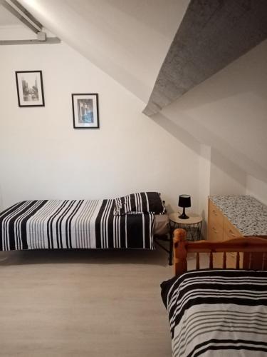 Ein Bett oder Betten in einem Zimmer der Unterkunft Gîte de la Belle Étoile