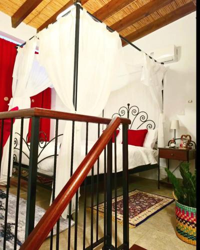 a bedroom with a bed with a canopy at Kozakos Luxury House in Pano Lefkara
