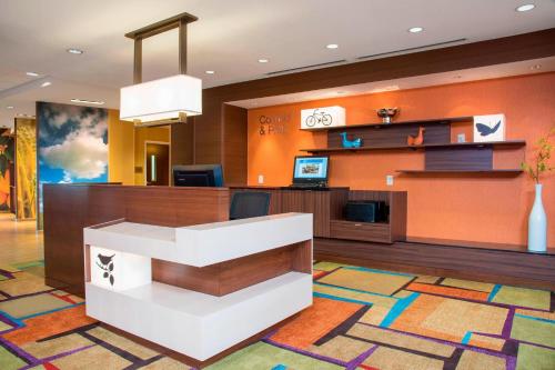 a lobby of a hotel with a reception desk at Fairfield Inn & Suites by Marriott Fredericksburg Texas in Fredericksburg