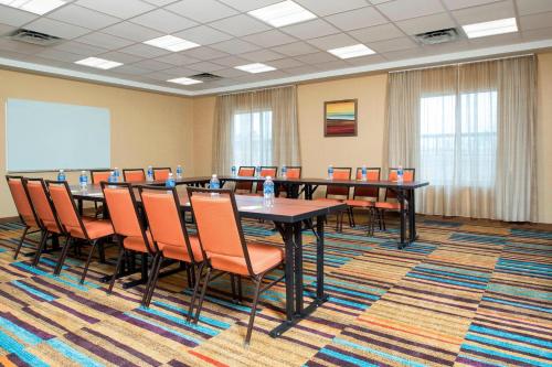 a conference room with a long table and chairs at Fairfield Inn & Suites by Marriott Fredericksburg Texas in Fredericksburg