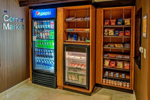 a refrigerator in a store with its door open at Fairfield Inn & Suites Memphis Olive Branch in Olive Branch