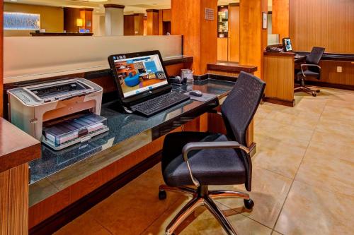an office with a desk with a laptop computer on it at Fairfield Inn & Suites Memphis Olive Branch in Olive Branch