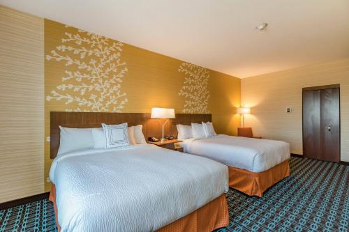a hotel room with two beds and two lamps at Fairfield Inn & Suites by Marriott Elkhart in Elkhart