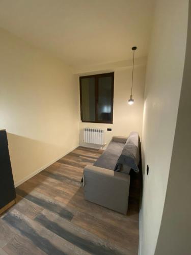 a living room with a couch and a window at Menechyan's Apartment in Yerevan