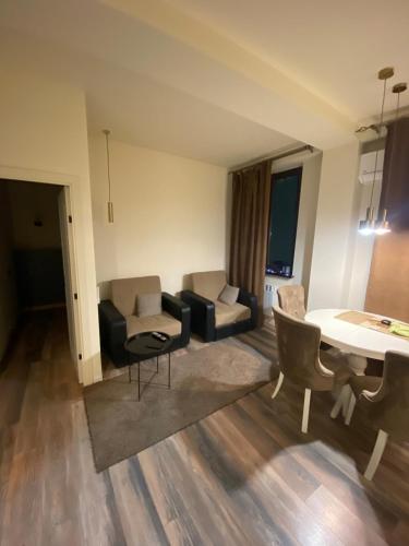 a living room with a couch and a table at Menechyan's Apartment in Yerevan