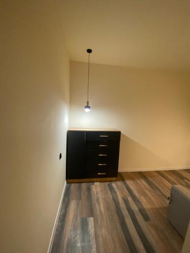 a living room with a dresser and a couch at Menechyan's Apartment in Yerevan