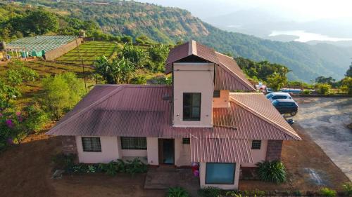 an aerial view of a house with a roof at Lifeline Villas- Backwater Breeze Valley View Luxurious Infinity Pool Villa With Huge Open Area in Mahabaleshwar