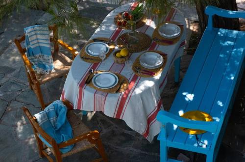 a table with plates and dishes on top of it at Kassandra in Sivota