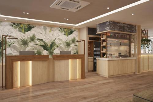 a restaurant with potted plants on the wall at Fairfield by Marriott Medellin Sabaneta in Medellín
