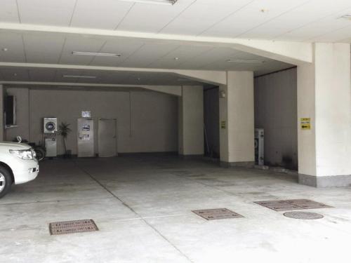 a parking garage with a car parked in it at Uwajima Regent Hotel in Uwajima