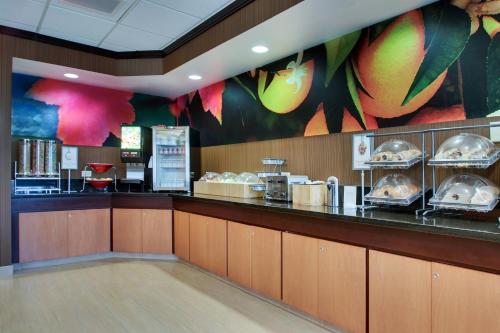 a fast food restaurant with a counter with food at Fairfield Inn & Suites by Marriott Ottawa Starved Rock Area in Ottawa