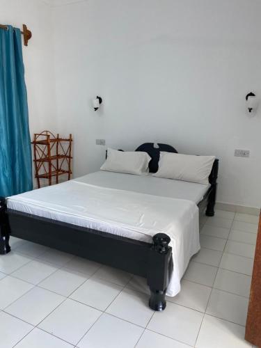 Ένα ή περισσότερα κρεβάτια σε δωμάτιο στο pole inn villa