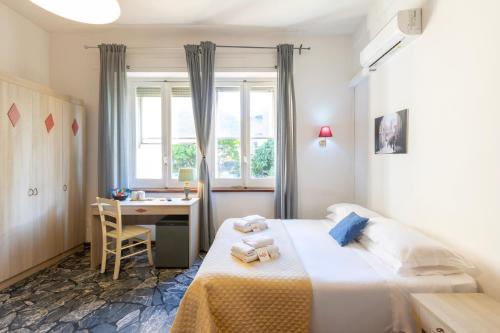 A bed or beds in a room at Kaliè Rooms Guest House