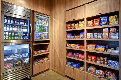 a refrigerator filled with lots of food and drinks at Fairfield Inn & Suites by Marriott Milwaukee North in Glendale