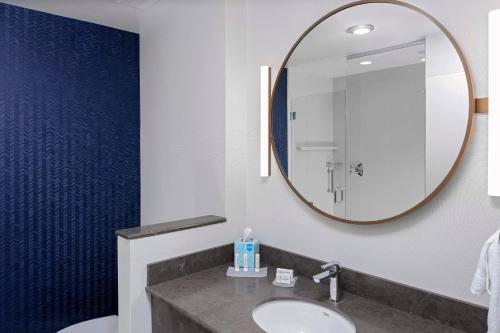 a bathroom with a sink and a mirror at Fairfield Inn & Suites by Marriott Memphis Collierville in Collierville