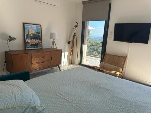 Postel nebo postele na pokoji v ubytování Joli appartement avec vue incroyable